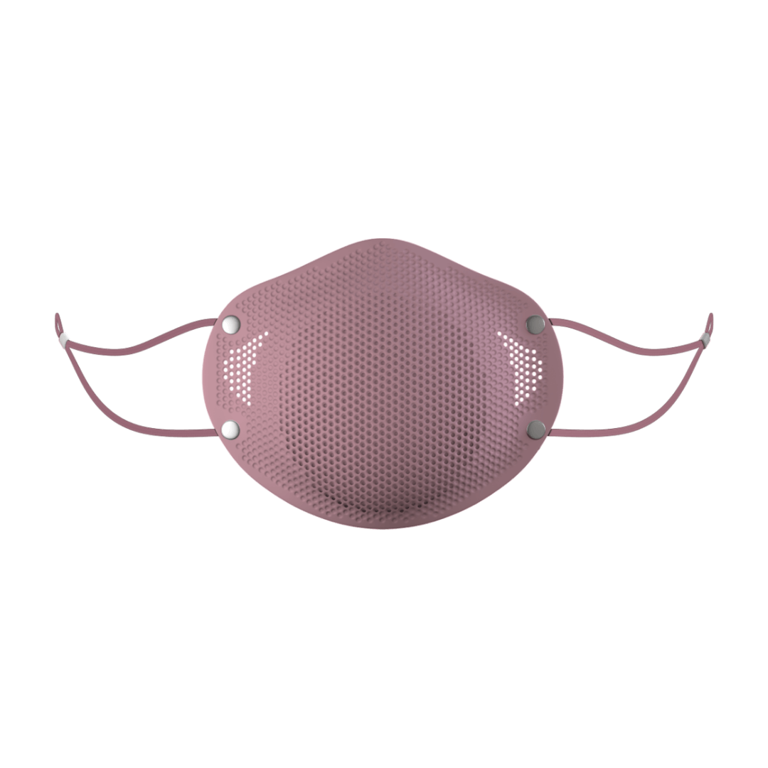 Fashionable, modern mask in soft pink hue, straps are featured with adjustments and the front of the mask has small holes similar to a speaker, to show off filter capability