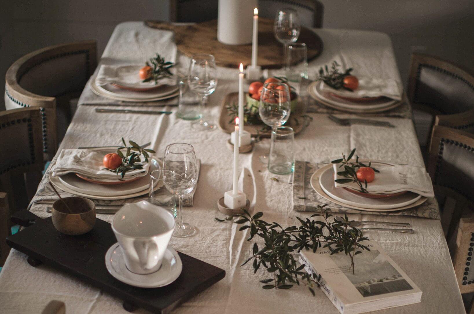 Neutral Holiday Tablescape with a pop of color from fruits and greenery